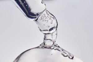 pipette,with,cosmetic,gel,or,serum,close up.